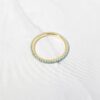 925 silver ring with lab created turquoise stones and a polished finish