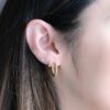 Twisted hoop earrings with a clean, modern small profile