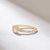 Accented solitaire ring with subtle surrounding details