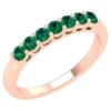 Emerald eternity ring with half band setting