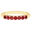 Sterling silver ring with infinity-inspired band design and ruby accents