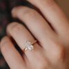 Long pear diamond ring with clean, refined styling