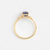 Silver ring with polished finish and blue sapphire-inspired stone