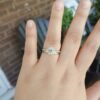 Engagement ring with thick gold plating and side stone accents