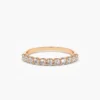 Pave-set wedding band designed to sit beside an engagement ring