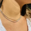 Round 6.35mm stones create a bold, continuous tennis necklace profile
