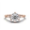 Ring with round centre stone, delicate side accents and classic prong setting