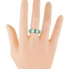 2.7 carat eternity band with continuous green and clear stones