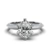 Classic engagement ring with a clean solitaire design and pavé details