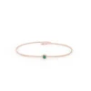 Minimal sterling silver bracelet with a fresh green emerald accent