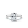 Oval shape engagement ring with four round side stones