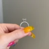Engagement ring featuring a brilliant round stone