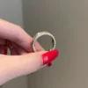 Men's wedding band featuring pavé CZ diamond accents