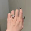 Sterling silver ring with a brilliant oval-cut stone and hidden halo