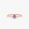 Gold-plated ring featuring a round amethyst stone with diamond details