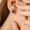 Amethyst stud earrings featuring 6.9 mm cushion-cut stones