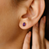 Amethyst stud earrings featuring two 6 mm purple stones