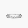 Delicate eternity ring with 18 round stones and balanced design