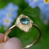 Art Deco sterling silver ring with a teal sapphire centre stone