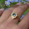 Ring with a 5 mm teal sapphire and clean vintage-inspired lines