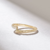 Bypass wedding ring with a graceful ascending stone arrangement