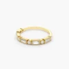 Delicate ring with a polished bezel setting and clean lines