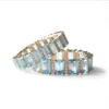 Blue topaz and diamond baguette eternity band in sterling silver