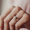 Modern band ring with baguette-style stones and polished finish