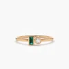 Refined ring with clean lines and a baguette-cut emerald detail