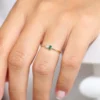 Baguette emerald and round diamond ring with a polished profile