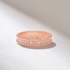 Distinctive beaded wedding band with rounded, patterned edges