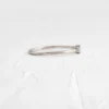 Sleek sterling silver ring with polished bezel settings