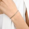Blue sapphire and diamond bracelet with half bezel setting