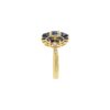 Floral ring design with blue sapphire accents and balanced pave setting