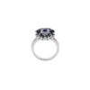 Ring featuring a balanced flower motif and blue stones