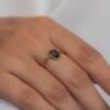 925 sterling silver ring featuring one uneven blue sapphire in prong setting