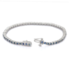 Blue sapphire tennis bracelet with half bezel settings