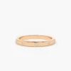 Diamond wedding ring featuring a clean flush-set stone design
