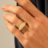 Gold-plated statement ring with a smooth channel setting