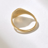 Round celestial pinky ring with a distinctive compass detail