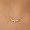 Diamond cluster necklace with a balanced curved silhouette