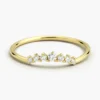 Curved sterling silver ring with a slim band and stones