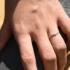 Diamond ring with a graceful curved silhouette and slim profile