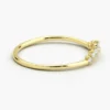 Curved ring featuring a row of varying-sized stones