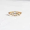 Pave-set wisp ring with a graceful modern profile