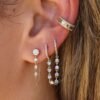 Thick gold-plated sterling silver hoop earring with connecting chain detail