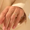 Sterling silver ring with engraved flat band and bezel-set CZ diamond