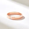 Minimal sterling silver ring with smooth bezel setting and subtle sparkle