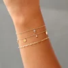 Elegant cross charm bracelet in 925 sterling silver with CZ diamond