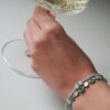 Tennis bracelet with baguette-style CZ emerald and diamond setting